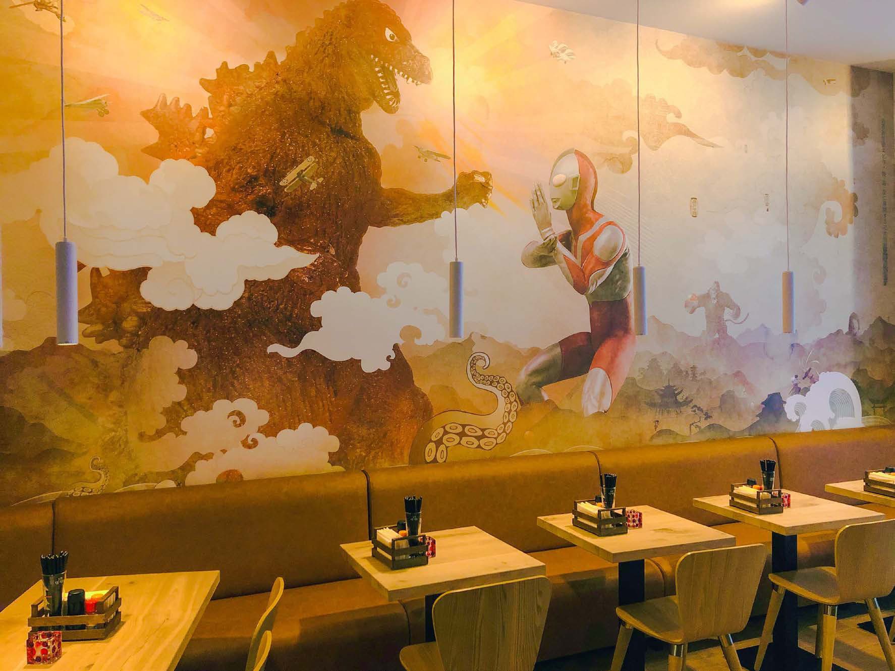 Bioscoopmural met filmpersonages in een restaurant